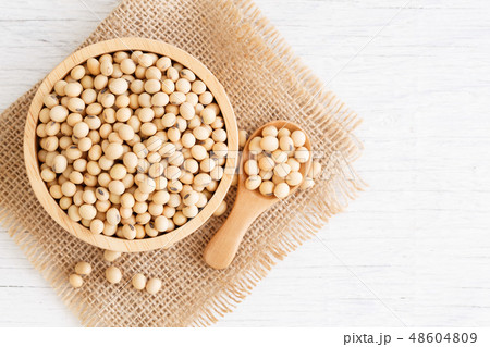 White wood floor with wooden cup with soybean White wood floor with wooden cup with soybean 48604809