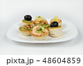 Several beautiful tartlets with different fillings 48604859