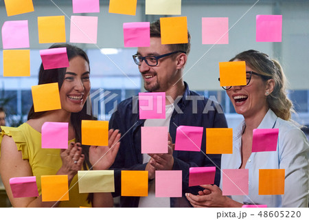 Two caucasian mature women and a man discussing ideas on sticker Two caucasian mature women and a man discussing ideas on sticker 48605220
