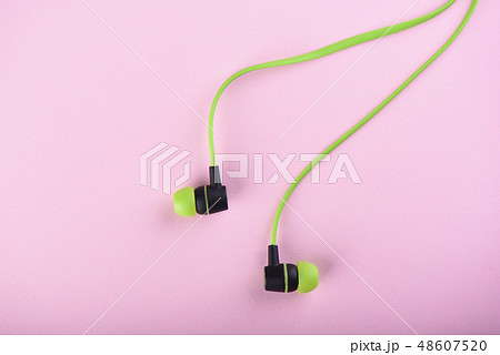 Green headphones or earphones isolated Green headphones or earphones isolated 48607520