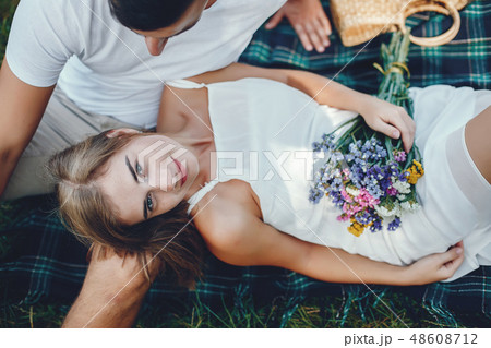 Beautiful couple spend time in a summer park 48608712