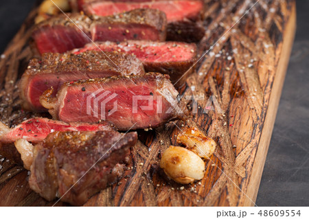 Closeup ready to eat steak new York. 48609554