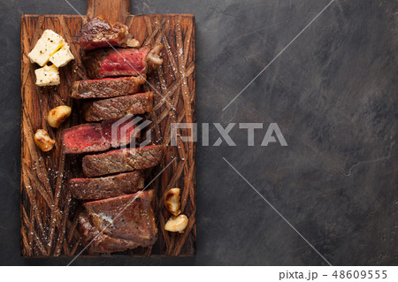 Closeup ready to eat steak new York. 48609555