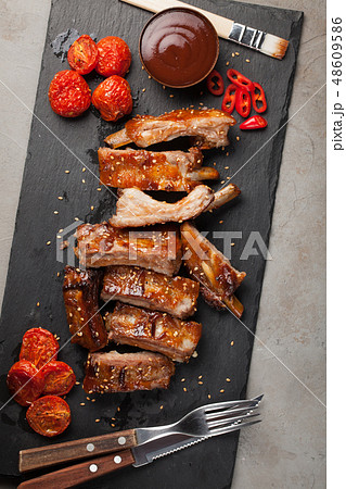 Grilled pork ribs in barbecue sauce. 48609586