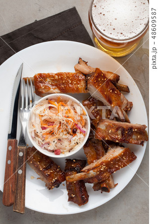 Grilled pork ribs in barbecue sauce. 48609587
