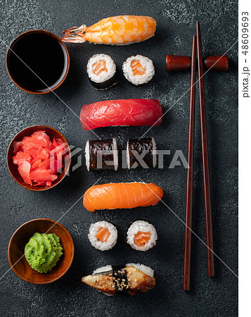 Set of sushi and maki on stone table. Set of sushi and maki on stone table. 48609693