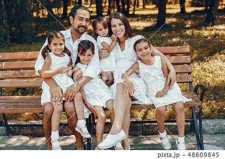 Big family playing in a summer park Big family playing in a summer park 48609845