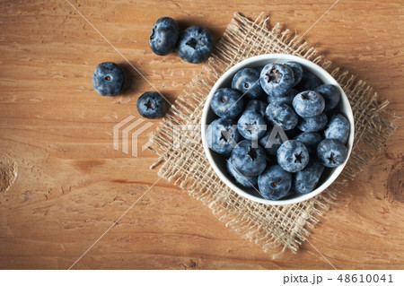 Blueberry on wooden table. Blueberry on wooden table. 48610041
