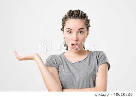 girl with braids having doubt 48610239