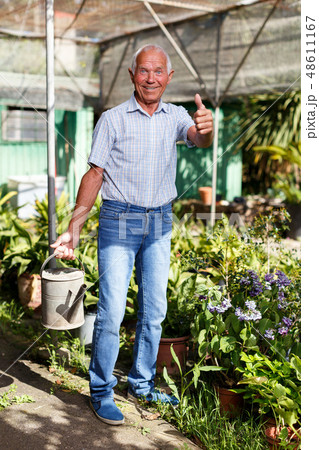 Older man proud of his garden Older man proud of his garden 48611167
