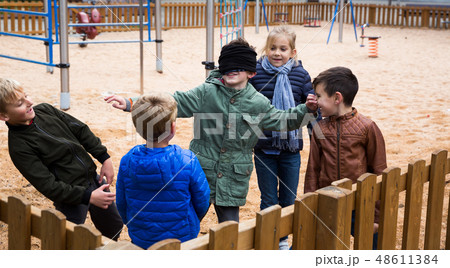 Children play in the blind man's buff 48611384