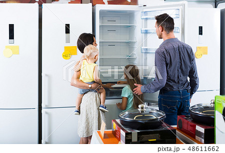 family choosing new fridge 48611662