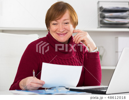 Woman working productively Woman working productively 48612018