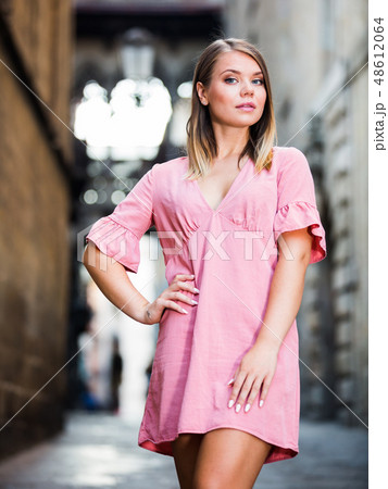 Young woman standing at the street among architecture in Barcelona 48612064