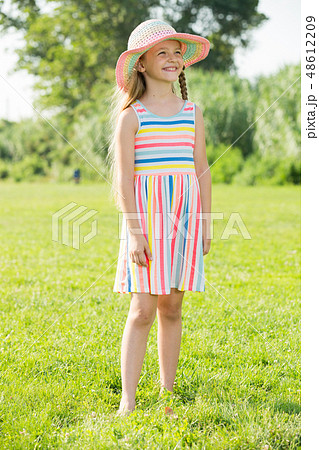 girl standing outdoors girl standing outdoors 48612209