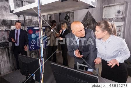 Businesspeople in escape room stylized under laboratory Businesspeople in escape room stylized under laboratory 48612273