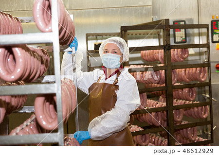 Woman with sausage trolley 48612929