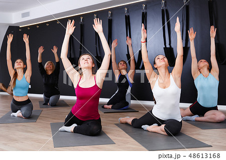 Females exercising during yoga class Females exercising during yoga class 48613168