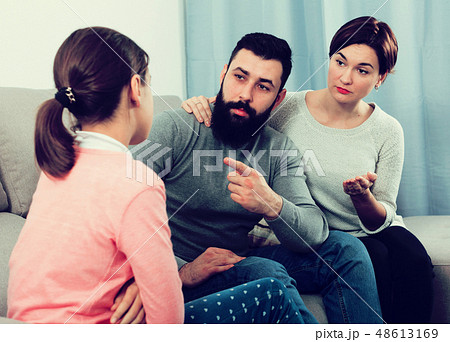 Parents lecturing daughter Parents lecturing daughter 48613169