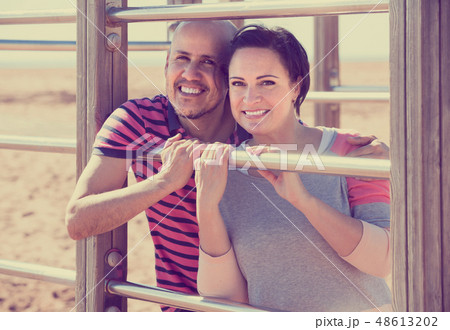 portrait of mature couple holding each other outdoors 48613202