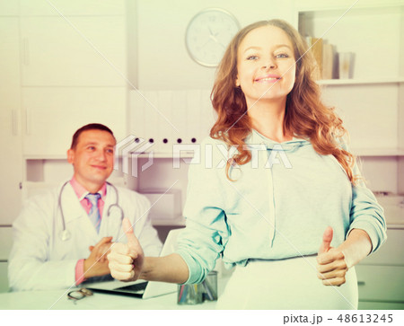 Doctor and pregnant visitor Doctor and pregnant visitor 48613245