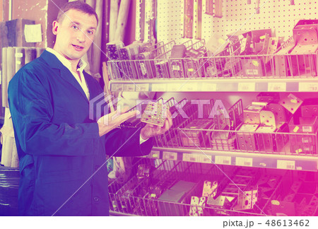 workman holding metal furniture 48613462