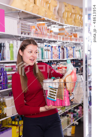 girl is standing with purchases for hair girl is standing with purchases for hair 48613954