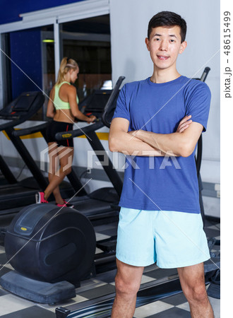Portrait of confident athletic male trainer 48615499