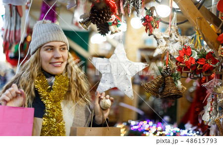 Cheerful girl at Christmas fair 48615793