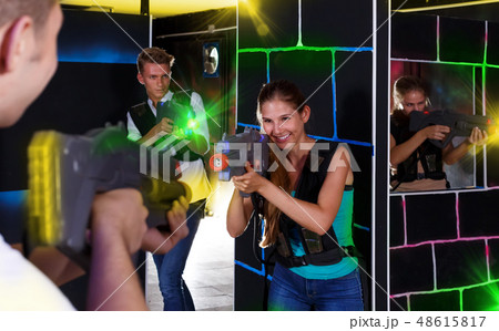 male and girl with laser guns male and girl with laser guns 48615817