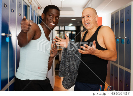 Two athletes in the locker room after training 48616437