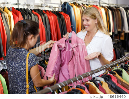 Displeased customer in leather clothes shop Displeased customer in leather clothes shop 48616440