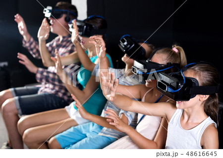 Parents with children are watching video 48616645