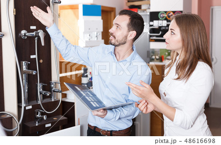 Family couple looking for new modern functional shower mixer Family couple looking for new modern functional shower mixer 48616698