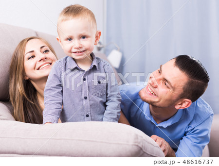 Glad wife and positive husband with little child 48616737