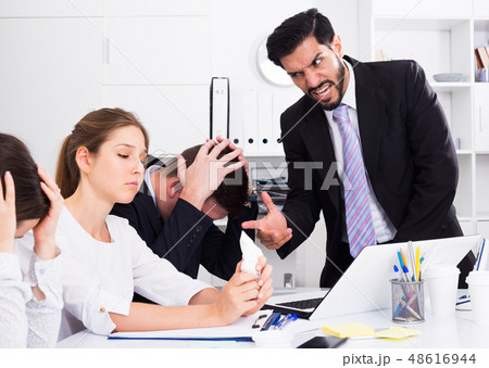 Irritated boss scolding subordinates 48616944