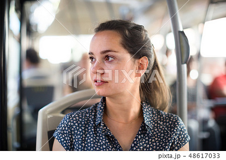 passenger taking bus journey 48617033