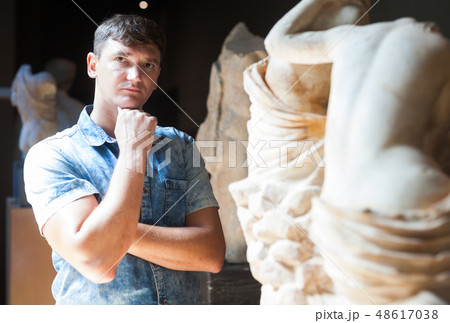 Man visiting sculpture hall Man visiting sculpture hall 48617038