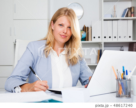 Lady business adviser working at office Lady business adviser working at office 48617240