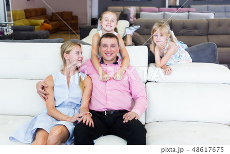 Parents with kids is pleased by new sofa Parents with kids is pleased by new sofa 48617675