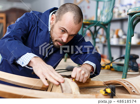 Carpenter repairing antique chair Carpenter repairing antique chair 48618574