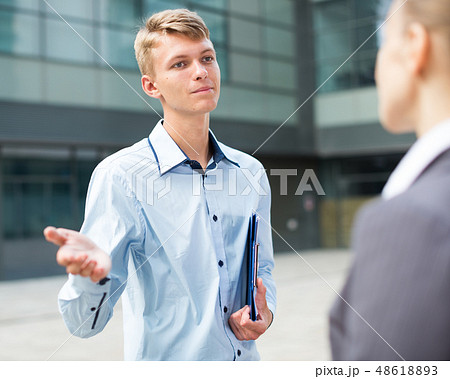 Businessman is talking with partner before signing contract 48618893