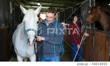 Man in casual clothes who works at stable 48618950