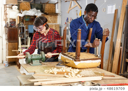 Artisans in process of renewing armchair Artisans in process of renewing armchair 48619709