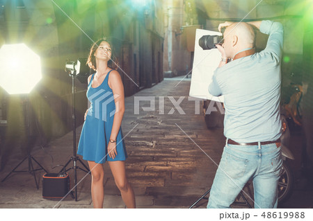 woman posing for professional photographer woman posing for professional photographer 48619988