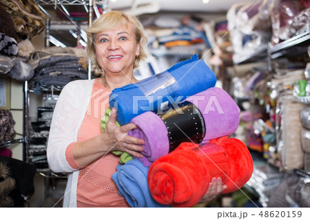 mature woman purchaser holding cotton plaids 48620159
