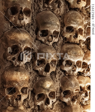 Skull and human bones. Cemetery ancient wall pattern. Horror dark chapel. Death pattern concept Skull and human bones. Cemetery ancient wall pattern. Horror dark chapel. Death pattern concept 48623951