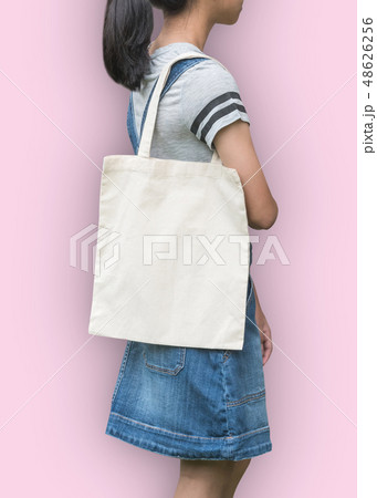 Canvas tote bag mockup fabric texture on shoulder Canvas tote bag mockup fabric texture on shoulder 48626256