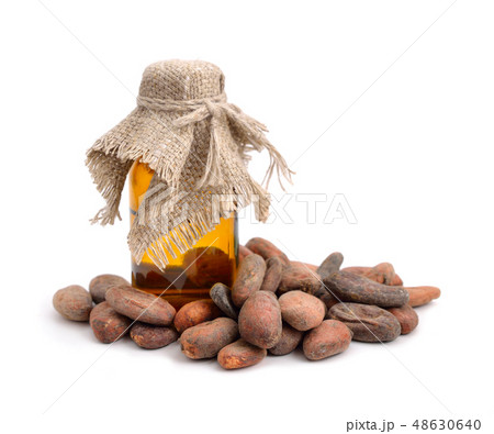 Cocoa beans before roast with pharmaceutic bottle 48630640