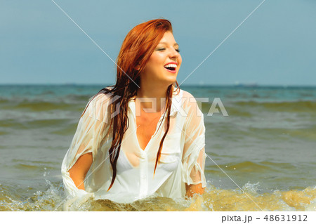 Vacation. Girl in water having fun on the sea. Vacation. Girl in water having fun on the sea. 48631912